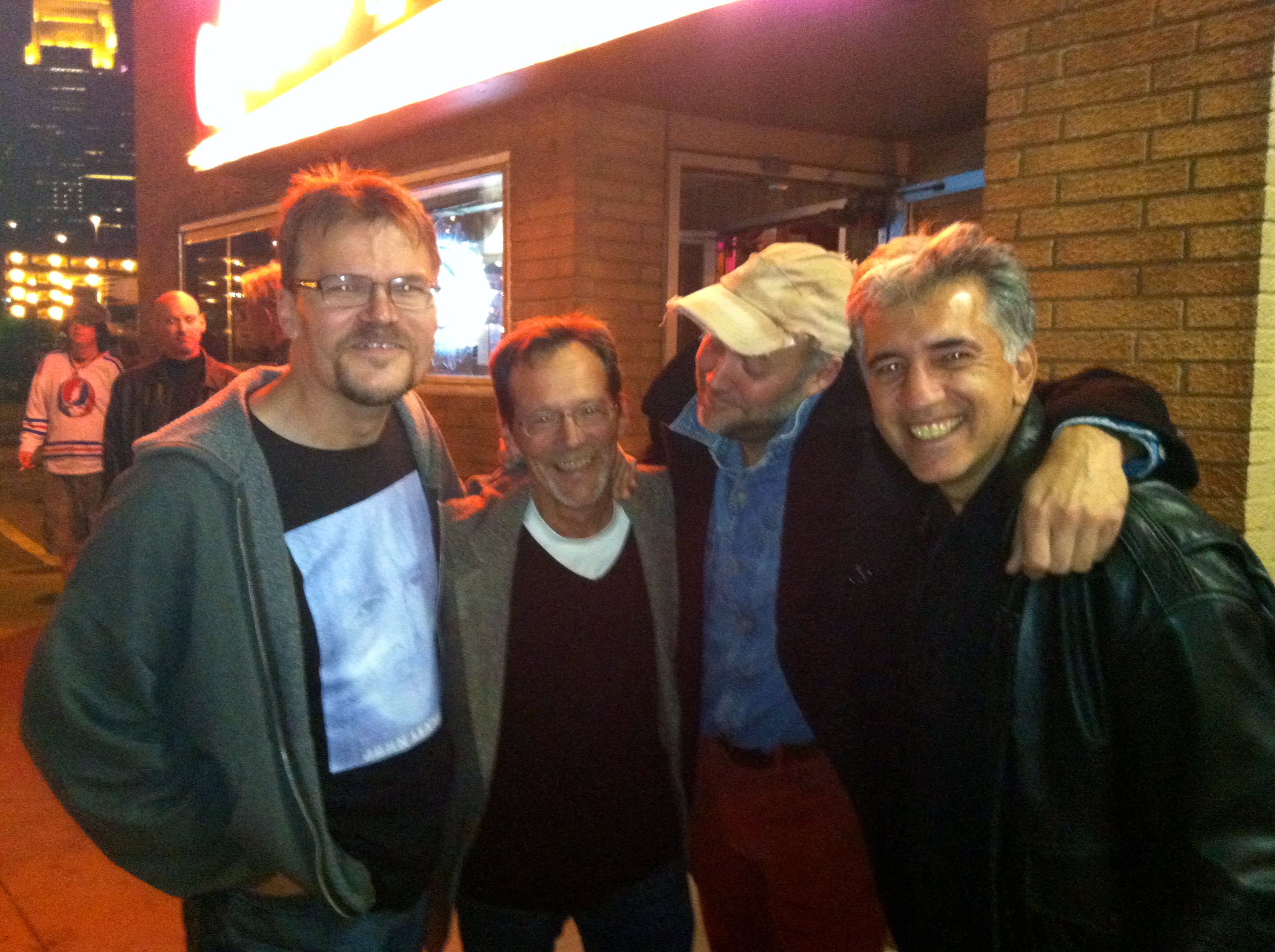 The Oarsmen, left to right, Kevin Featherly, Mike Olk, Barron Whittet and Scott Maida, outside Lee's Liquor Lounge, where the benefit will be held. Photo by Dave Wildermuth.