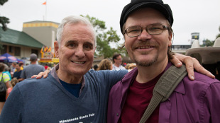 Minnesota Gov. Mark Dayton wonders why the guy in the funny hat has his arm around his his shoulder at the Minnesota State Fair, Aug. 23, 2014. It was my good fortune that the governor granted me an interview at the end of my run as political newspaper reporter for Capitol Report/Politics in Minnesota. Photo: Matt Swenson